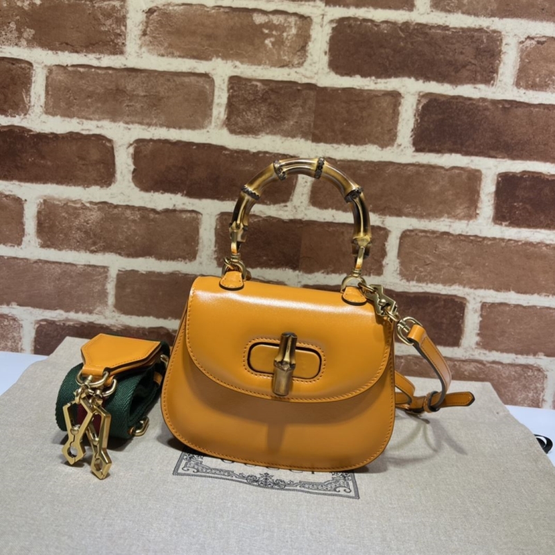 G*u*i top handle bags